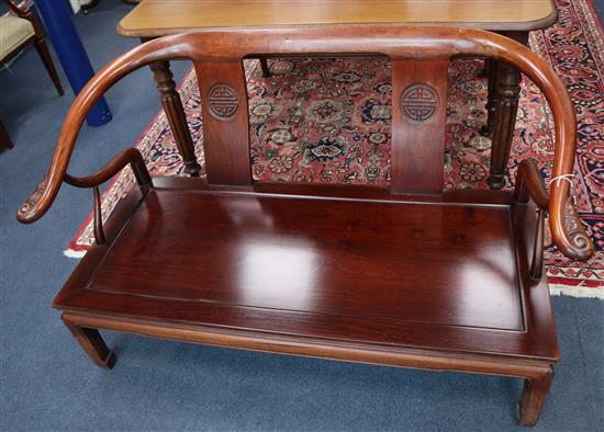 An Oriental hardwood sofa W.130cm